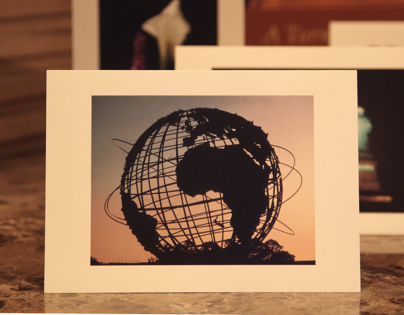 World card — the Unisphere at sunset