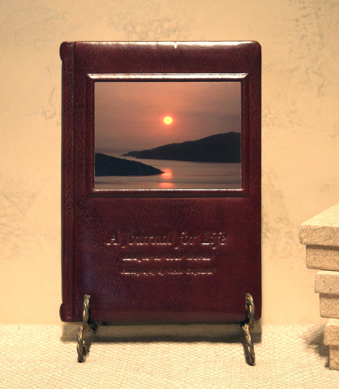 A Journal for Life, sunset leather edition on a stand